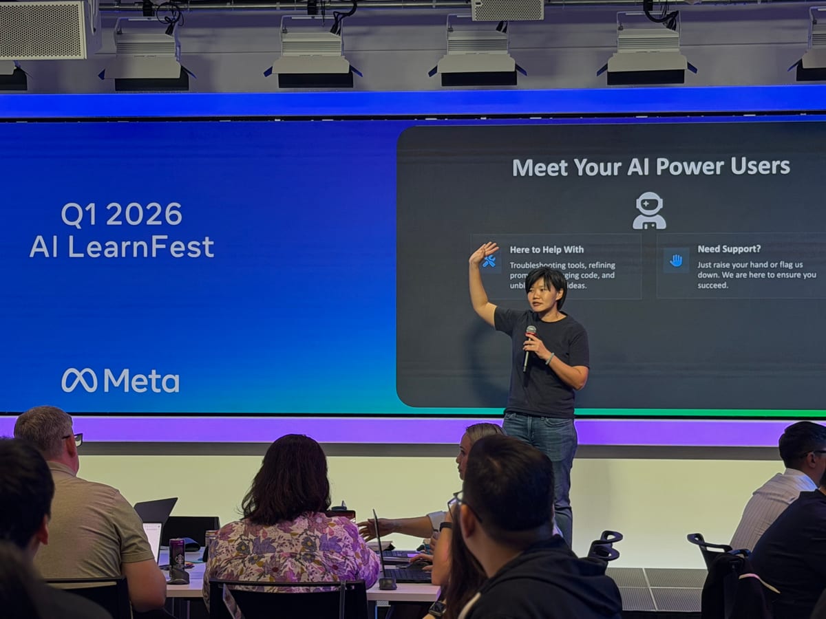 Joanne on stage with a microphone at AI LearnFest 2026, in front of a slide titled “Meet Your AI Power Users”.